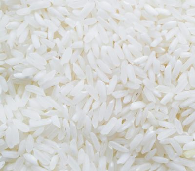 A detailed close-up shot showcasing a generous amount of white rice grains, ideal for culinary themes.